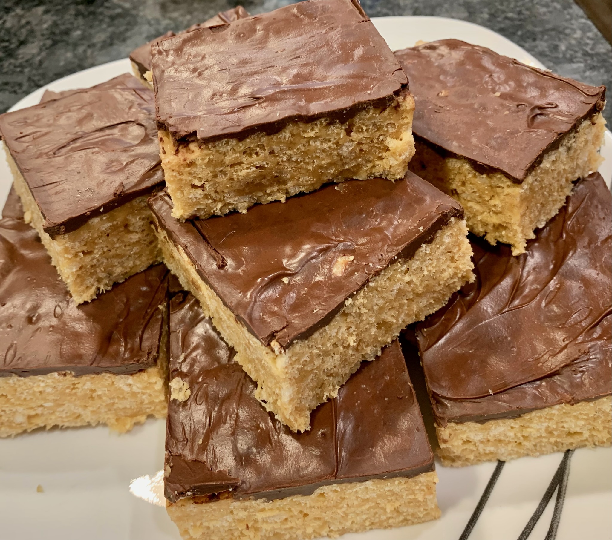 Peanut Butter Rice Krispy Treats Topped with Ghirardelli Chocolate | The Rogue Chef